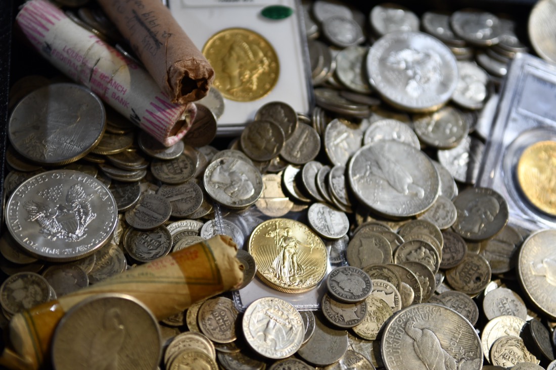 Tray of silver dollars, gold coins and coin rolls